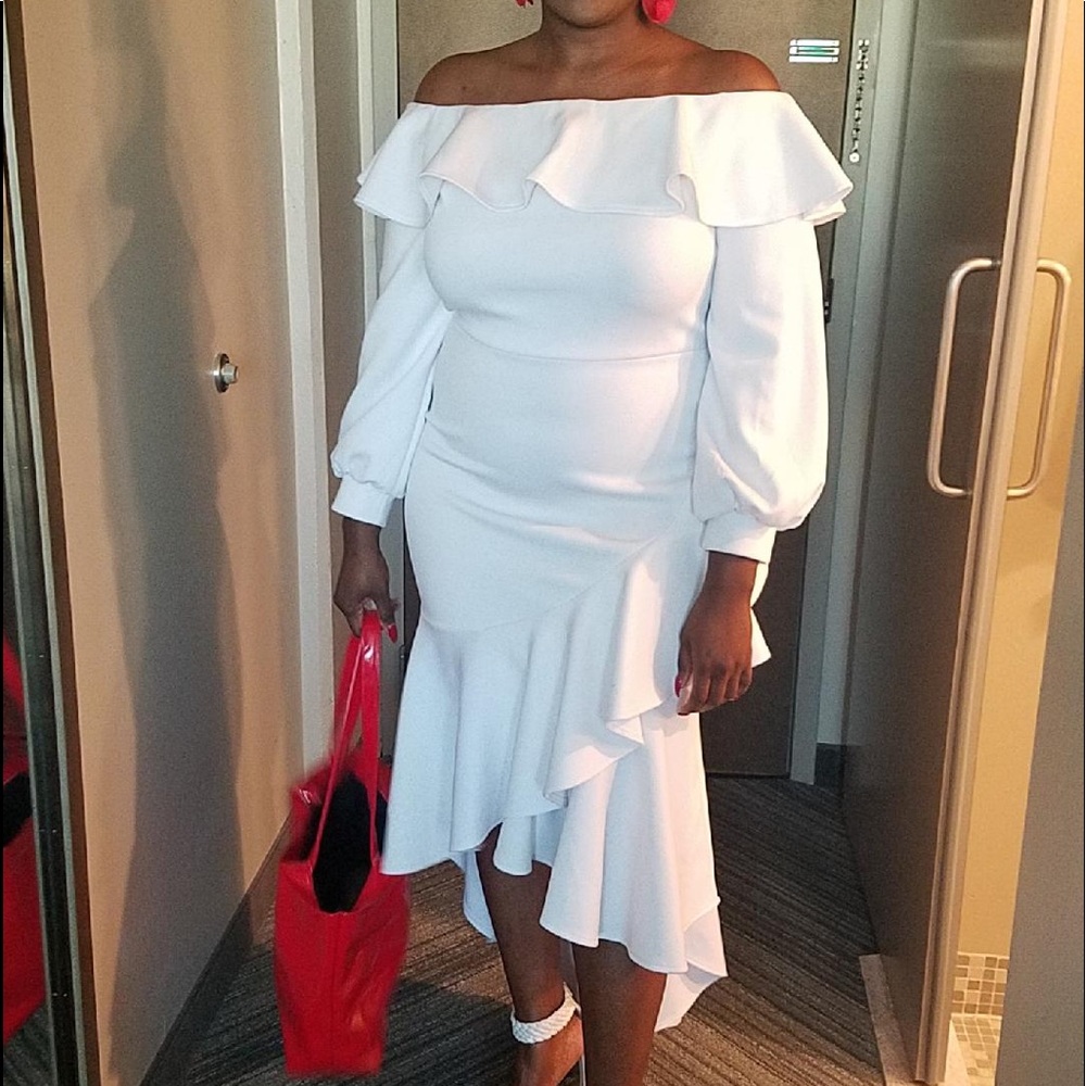 White off the shoulder high low ruffle dress.